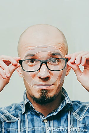 Smiling young man on white background. Stylish man wearing glasses, looking at camera and smiling Stock Photo