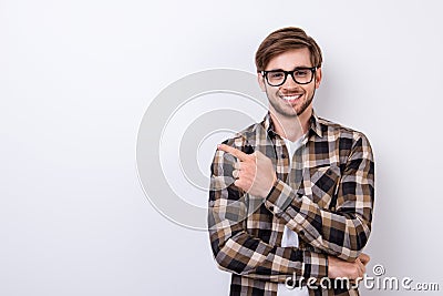 Smiling young nerdy bearded stylish student is standing on pure Stock Photo