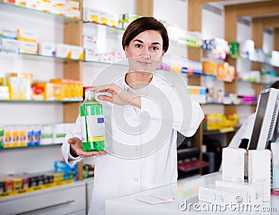 Pharmacist ready to assist in choosing at counter Stock Photo