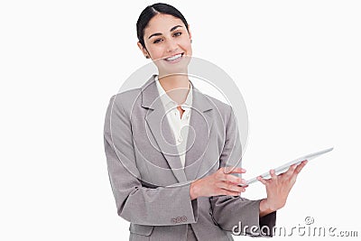 Smiling young saleswoman with her tablet computer Stock Photo