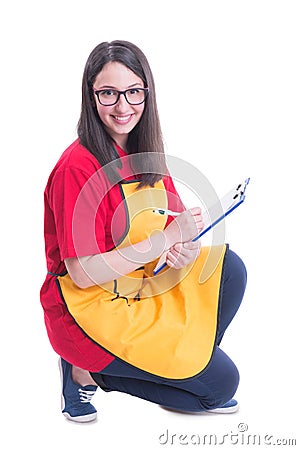 Smiling young supermarket seller counting the products Stock Photo