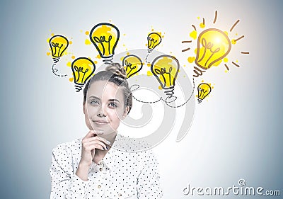 Smiling young woman dreaming, ideas Stock Photo