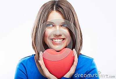 Smiling young woman hold red heart, Valentine day symbol. Girl Stock Photo