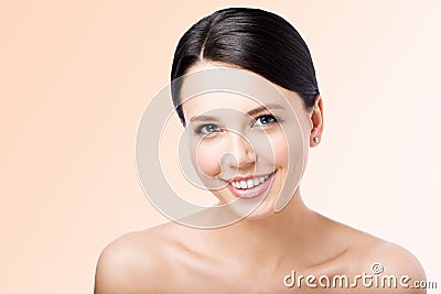 Smiling young woman. Perfect clean skin. Kind face. Closeup beauty Stock Photo