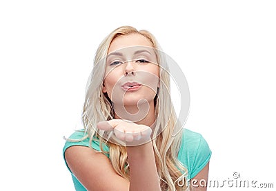Smiling young woman or teen girl sending blow kiss Stock Photo