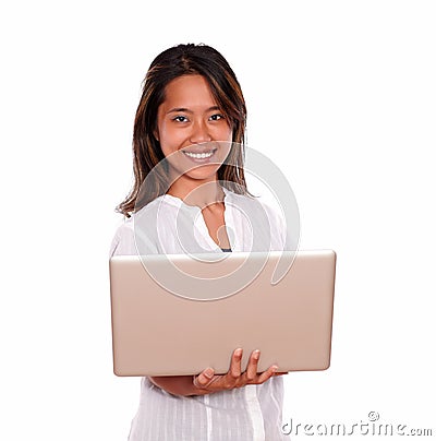 Smiling young woman using her laptop computer Stock Photo