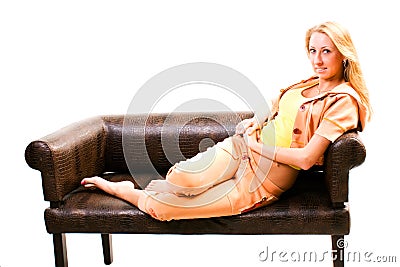 Smilling woman sitting on sofa Stock Photo