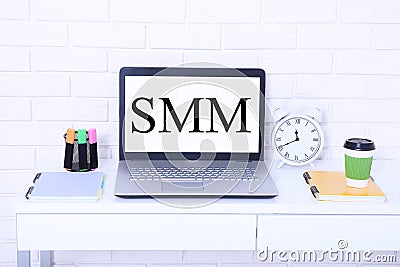 SMM Social Media Marketing Advertising Online Business Concept. Workplace with computer and cup of coffee. Copy space Stock Photo