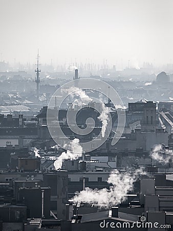 Smog - city air pollution. Unclear atmosphere polluted by smoke rising from the chimneys. Stock Photo
