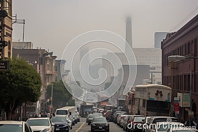 smoggy cityscape with towering smokestacks and heavy traffic Stock Photo