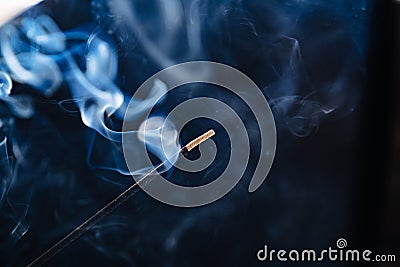 smoke from an aromatic stick on a black background. Stock Photo