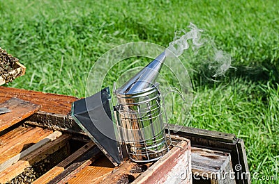 Smoke for the beekeeper. Apiary. Smoke. Beekeeper. Stock Photo