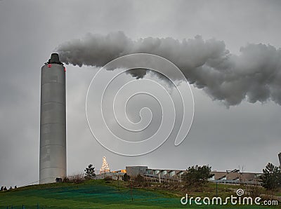 Smoke blowing from a factory tower in Copenhagen Stock Photo
