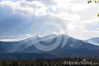 Smoke clinging to the mountains in the Schultz Fire near Flagstaff, Arizona. Stock Photo