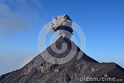 Smoke Column from the Chimney of Acatenango Volcano. Volcan del Fuego Erupting big black smokes in Guatemala Stock Photo