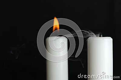 Burning and Blown Out Candle with Smoke Stock Photo