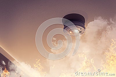 Smoke detector on ceiling detecting house fire Stock Photo