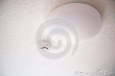 Smoke detector and fire protection system on ceiling Stock Photo