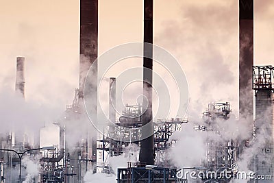 Smoke emitting in industry, outdoor view of oil factory. Stock Photo