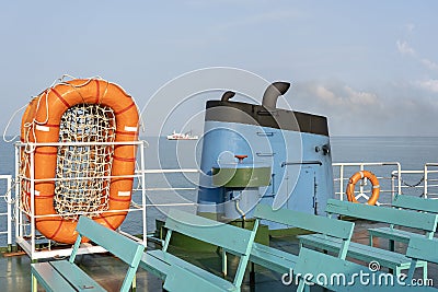Smoke from ferry boat flue during sea with sunlight, sea water and clear sky in background, Thailand Stock Photo