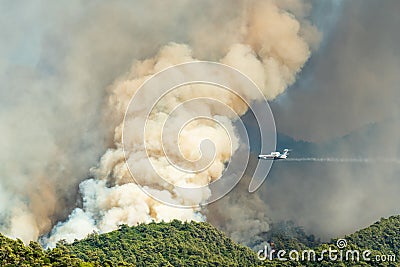 Smoke from a forest fire rising over Hisaronu neighbourhood of Marmaris resort town of Turkey Editorial Stock Photo