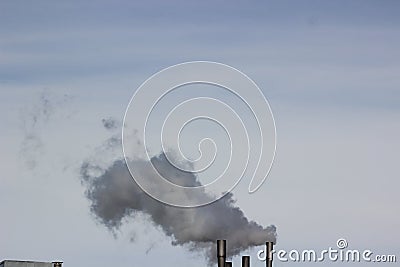 Smoke in the form of clouds coming from the factories Stock Photo