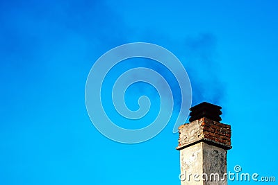 Smoke from house chimney Stock Photo