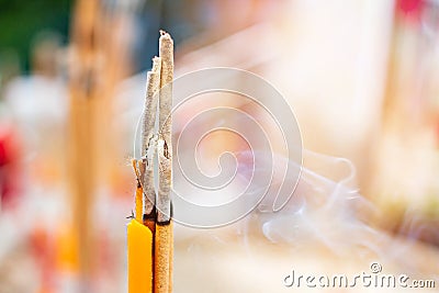Smoke, incense and candles, instead of the power of faith Stock Photo