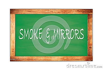 SMOKE & MIRRORS text written on green school board Stock Photo