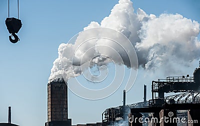 Smoke from a pipe factory polluting air Stock Photo