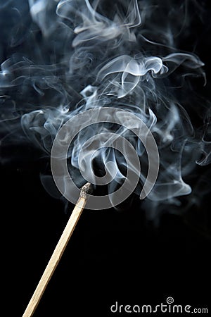 Smoke Rising from Burnt Out Match Stick Stock Photo