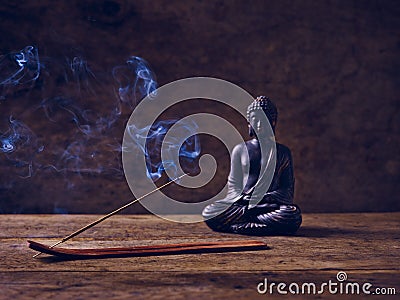 Smoke Wood Buddha joss stick Stock Photo