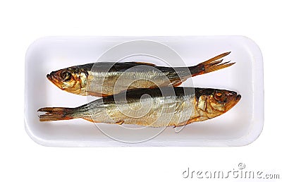 Smoked fish in the plastic plate Stock Photo