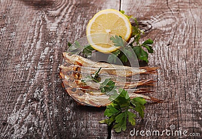 Smoked fishes with herbs Stock Photo