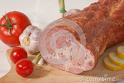Smoked ham on the bread-board Stock Photo