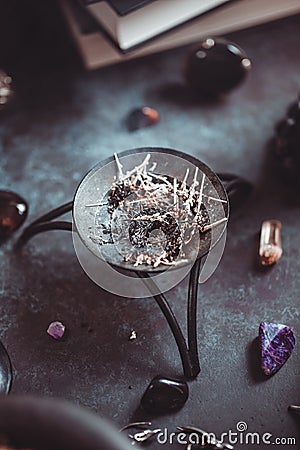 Smoked herbs on a witch`s altar for a magical ritual Stock Photo