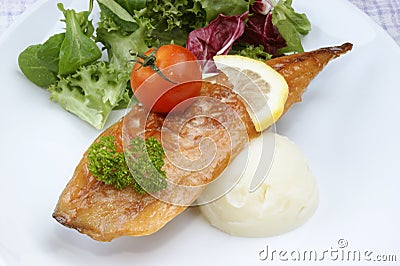 Smoked mackerel fillet with tomato Stock Photo