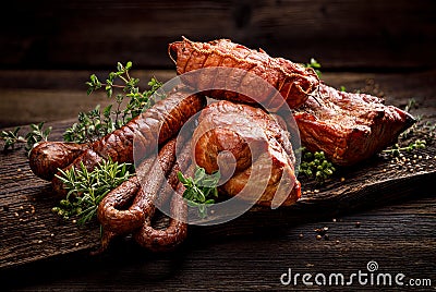 Smoked meats and sausages. A set of traditional smoked meats and sausages: ham,gammon, pork loin, home-style sausages, kabanosy. Stock Photo