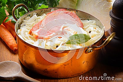 Smoked Pork Chop on Shredded Cabbage with Raisins Stock Photo