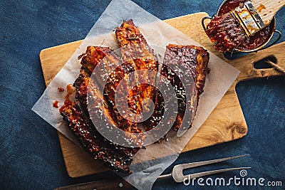 Smoked Roasted pork ribs over blue background. Barbeque spicy ri Stock Photo