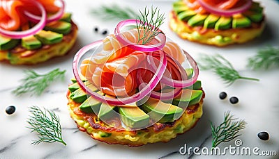 Smoked salmon with avocado and red onion on potato cakes Stock Photo