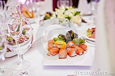 Smoked salmon roll with cheese. Banquet in a luxurious restaurant. Stock Photo