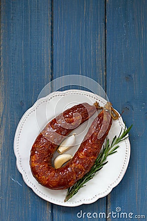 Smoked sausage on plate Stock Photo