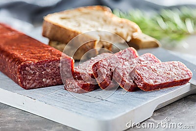 Smoked .sausage. Sliced salami on cutting board Stock Photo