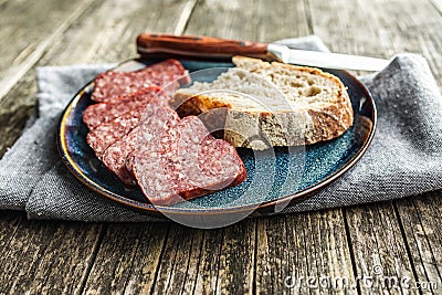 Smoked .sausage. Sliced salami on plate Stock Photo