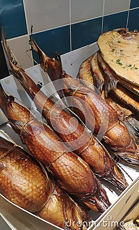 Smoked sea bass on the counter. Fish market. Stock Photo