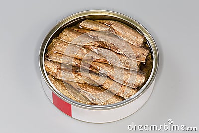 Smoked sprats in the open tin can close-up Stock Photo