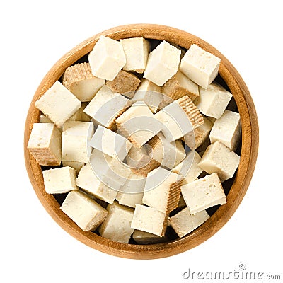 Smoked tofu cubes in wooden bowl Stock Photo