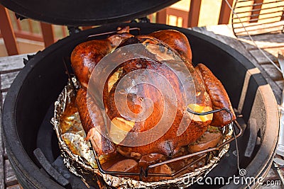 Smoked turkey cooked over kamado grill Stock Photo
