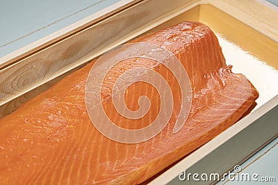 Smoked wild sockeye salmon inside wooden box close up Stock Photo